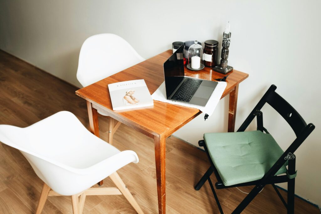 A clean and stylish minimalist home office with modern furnishings and decor elements.